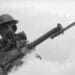 british wwii soldier in gas mask with rifle and bayonet